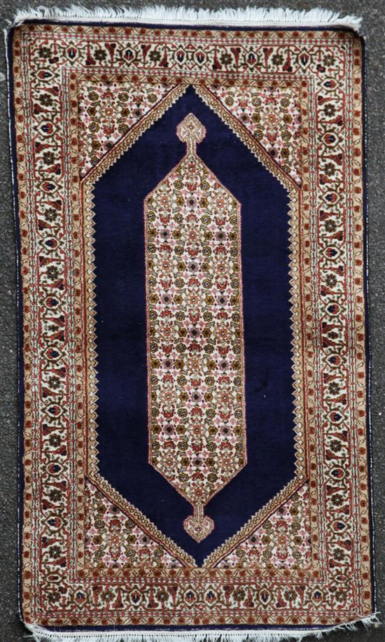 An Indian silk rug, 5ft 1in x 3ft.